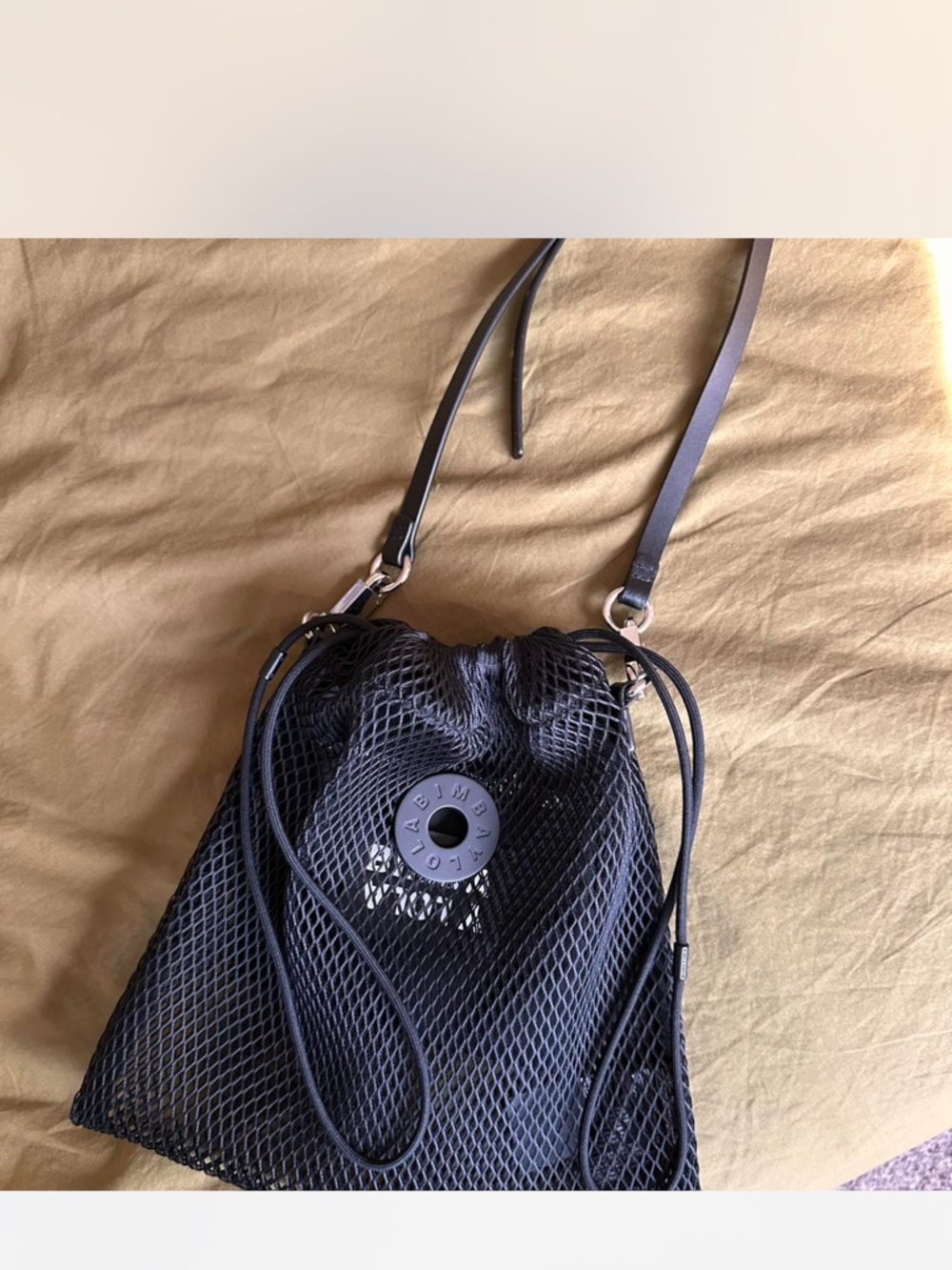 Black Mesh Drawstring Crossbody Bag with Branded Accent